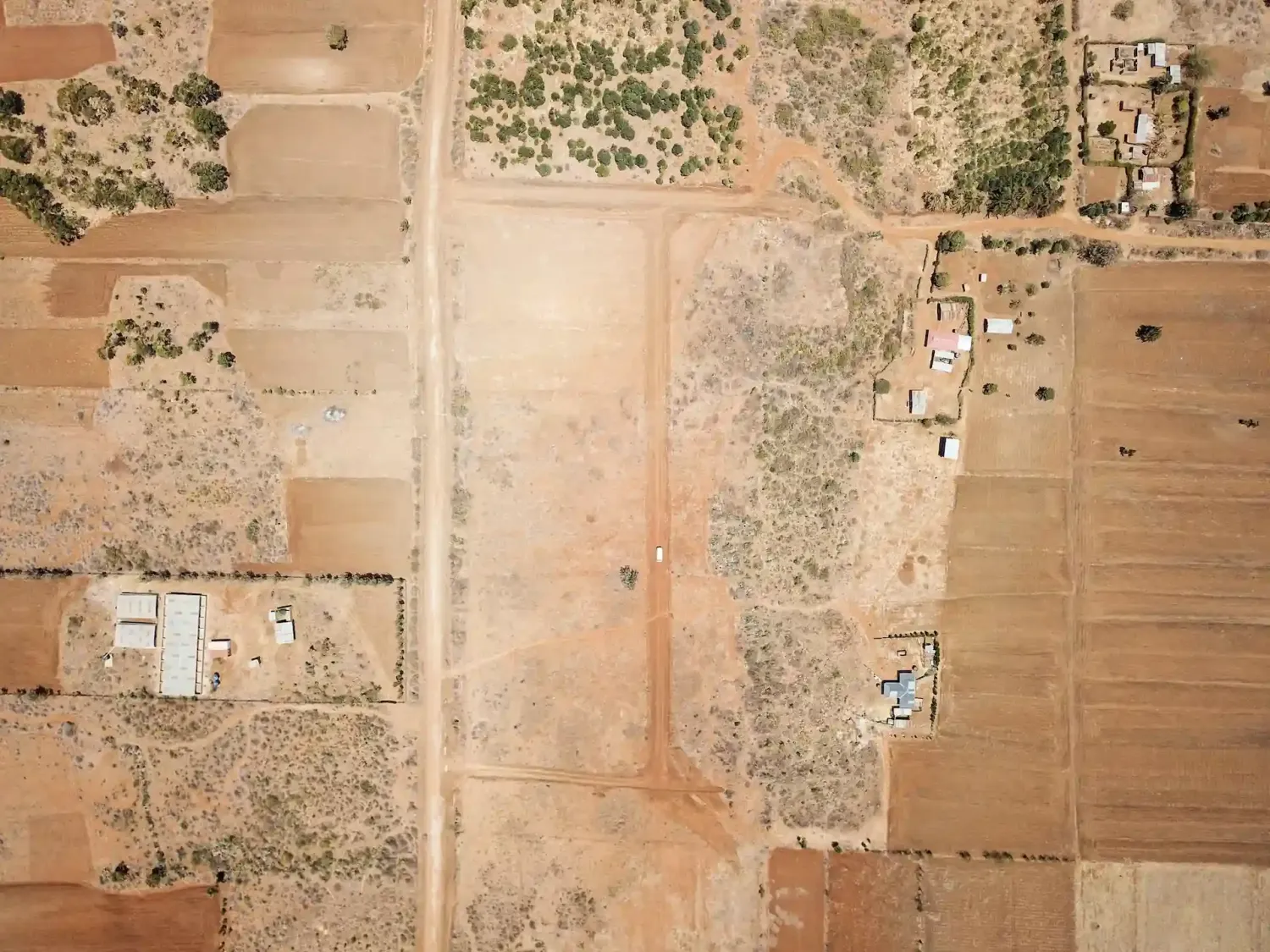 Top-down aerial of a plotted MilikiSpace corridor