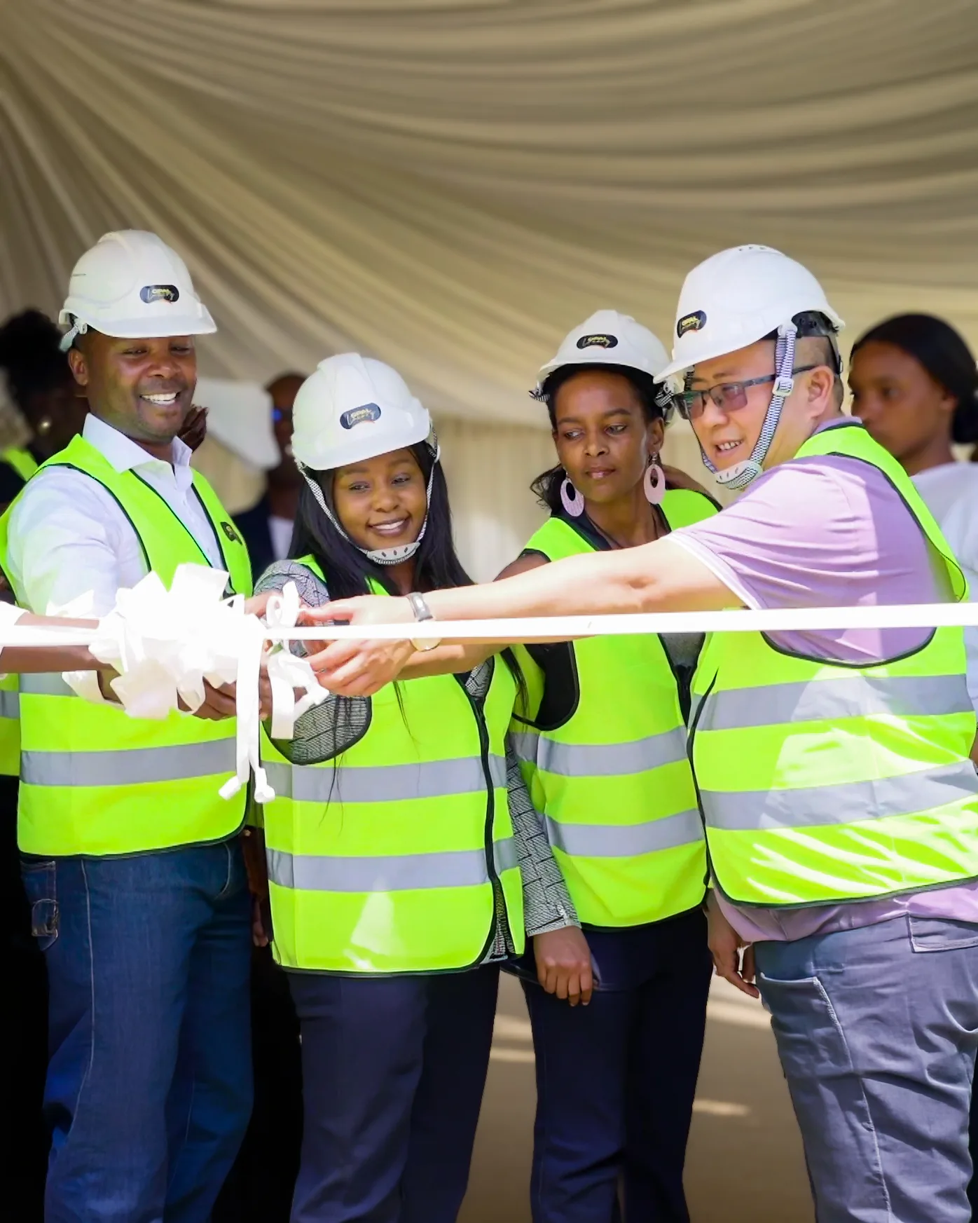 The team cutting the ribbon at the Opal Suites groundbreaking