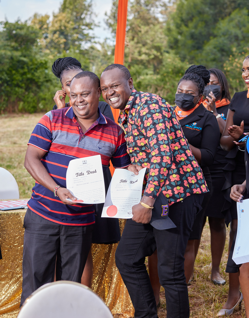 A MilikiSpace client receiving their property title documents